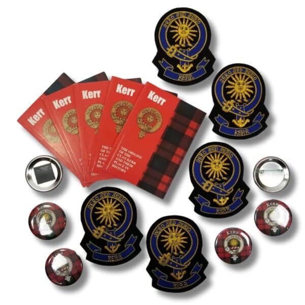 A collection of Armstrong Clan crests, circular pins, and red Kerr booklets with checkered patterns arranged on a white background.