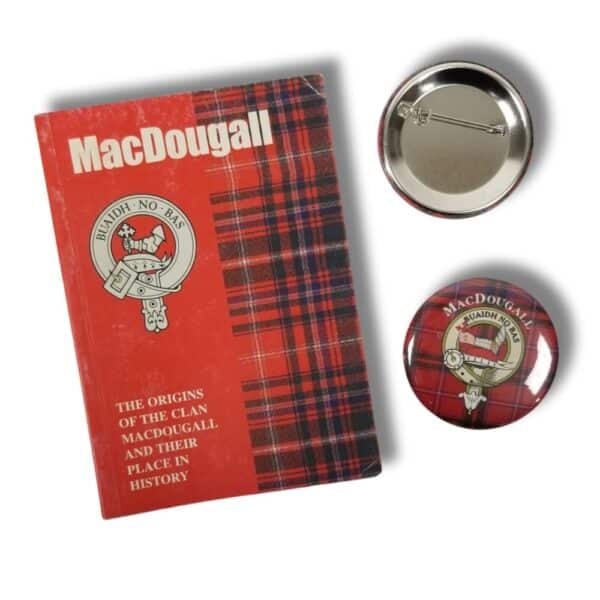 Displayed alongside two tartan-patterned buttons featuring the clan crest, the book titled "MacDougall: The Origins of the Clan MacDougall" offers insight into a storied heritage reminiscent of the rich traditions associated with products like Armstrong Clan.