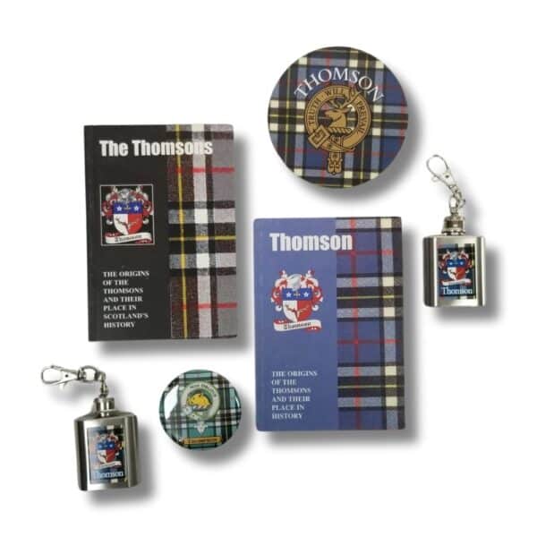 A variety of items featuring tartan patterns, including two books titled "The Origins of the Thomsons," a round tin, two small flasks, and two keychains—perfect for those intrigued by the histories of clans such as Armstrong.