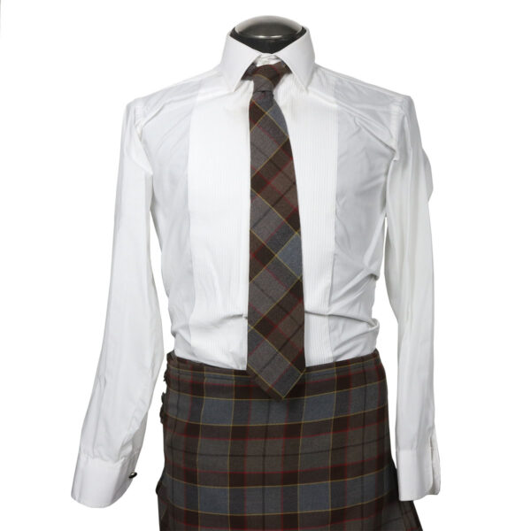 An Argyle Formal Shirt and Neck Tie Set and plaid kilt on a mannequin, along with a neck tie.