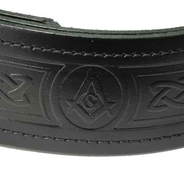 A black leather Masonic Embossed Quality Kilt Belt with a Masonic symbol on it.