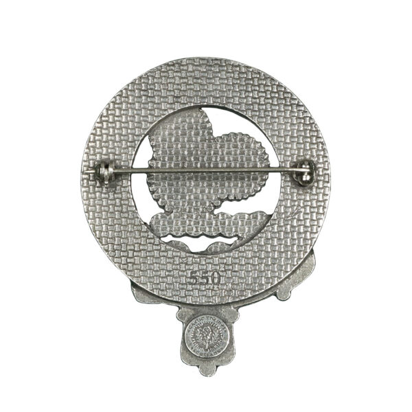 A silver Machine Gears Steampunk Cap Badge/Brooch with a bird on it.