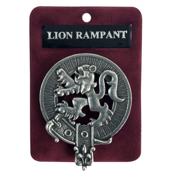 A package containing a metal Rampant Lion Cap Badge/Brooch.