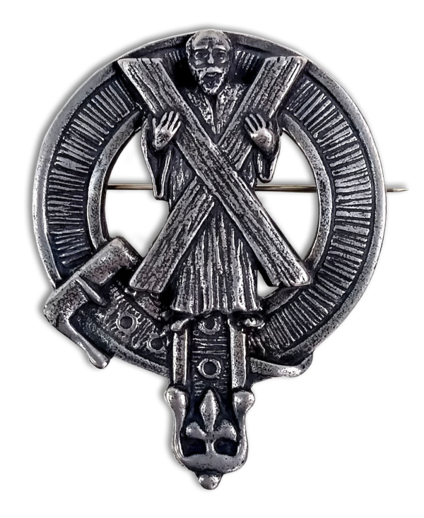 A silver brooch with an image of a man holding a cross.