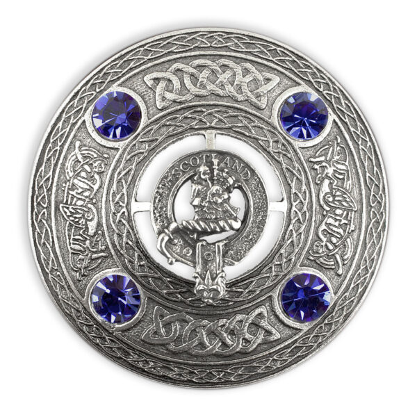 A silver Bagpiper Plaid brooch with blue sapphires.