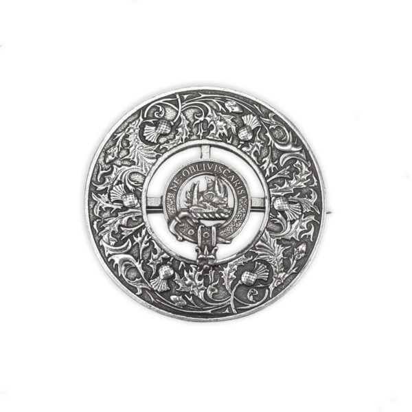 A silver Clan Crest Thistle Pewter Plaid Brooch with an ornate design on it.