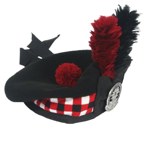 A black and red tartan Felted Wool Balmoral hat with a feather.