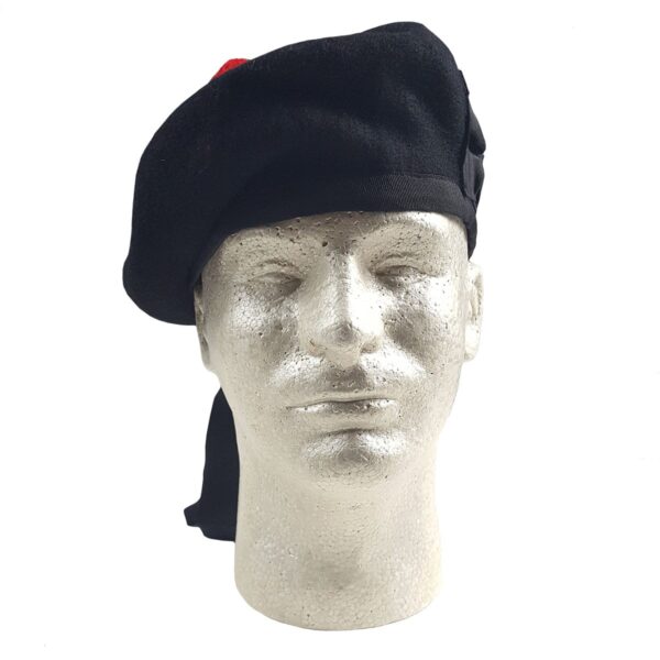 A black beret, resembling a Felted Wool Balmoral, on a mannequin head.