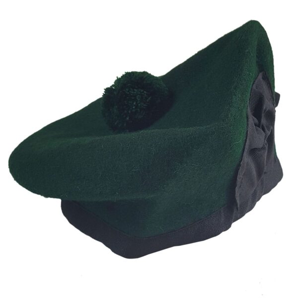 A green beret with a black pom pom, resembling the traditional Felted Wool Balmoral hat.