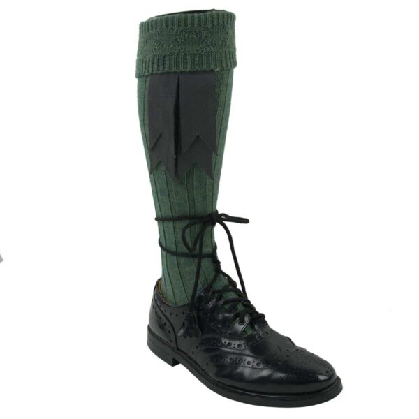 A pair of green Wool Flashes - Lochcarron of Scotland - Hook Closure knee high socks with black shoes.