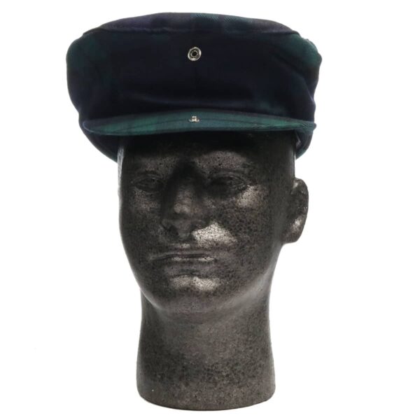 A mannequin head wearing a Black Watch Modern Tartan Driving Cap or Golf Cap.