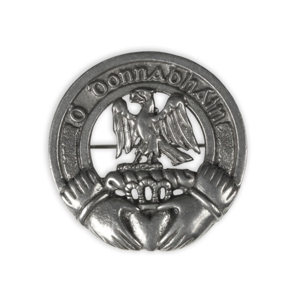 A silver badge with an eagle on it, resembling an Irish Coat of Arms Plaid Brooch.