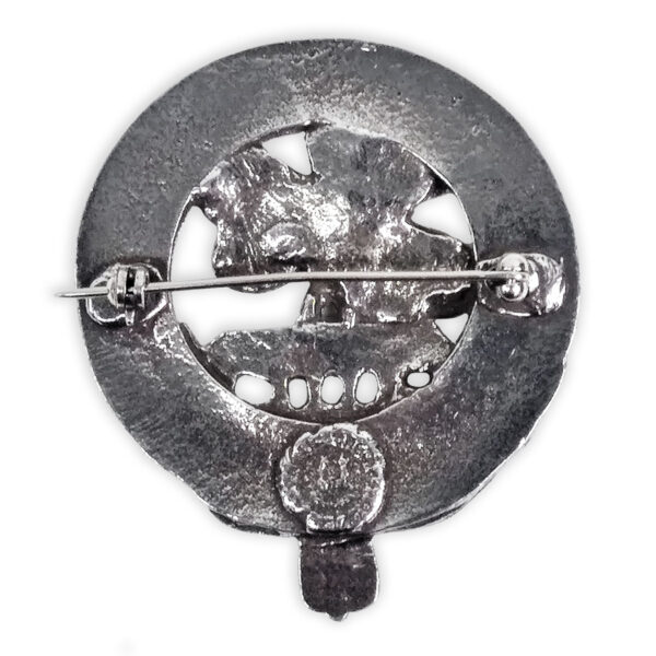 A silver Irish Shamrock Cap Badge/Brooch with a skull and crossbones.