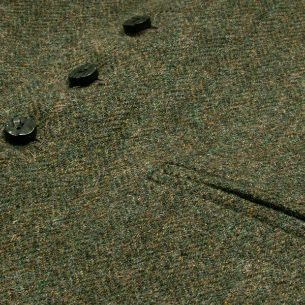 A close up of a green Tweed 5 Button Vest.