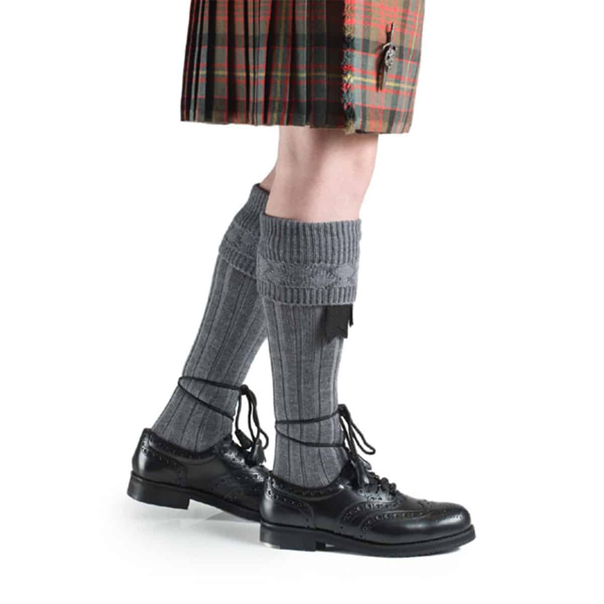 A person wearing a kilt and the Quality Wool Blend Kilt Hose.