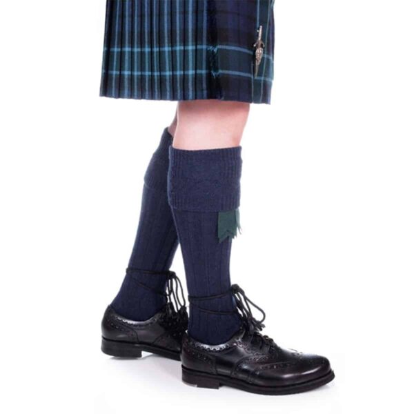 A person wearing the Quality Wool Blend Kilt Hose and black shoes.