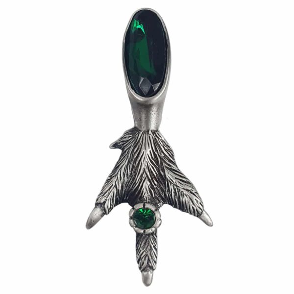 A Fancy Grouse Claw Kilt Pin with a green stone.
