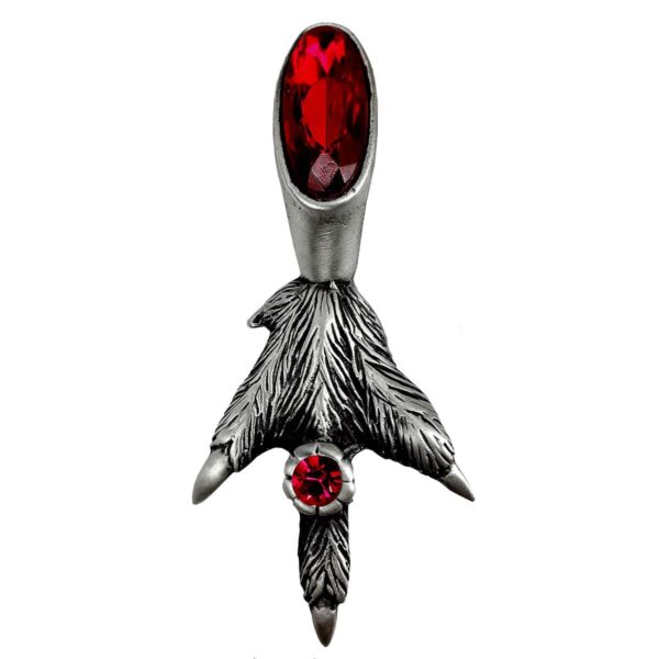 A fancy grouse claw kilt pin with a red stone.