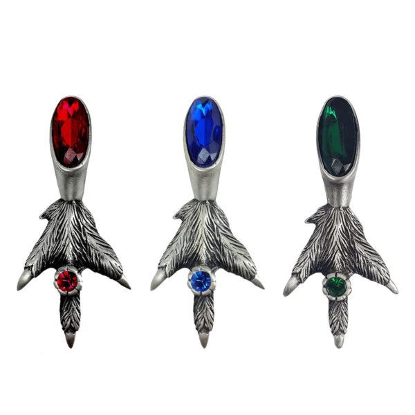 A pair of Fancy Grouse Claw Kilt Pin adorned with colorful red, blue, and green stones.