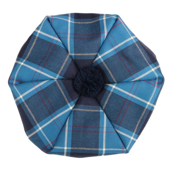 A blue and white plaid hat with a pom pom, also known as a U.S. Marine Corps Premium Light Weight Wool Tam, can be worn for various occasions.