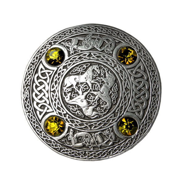 A silver Celtic Inverurie Pewter Plaid Brooch with yellow stones.