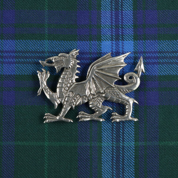 A Welsh Dragon Pewter Plaid Brooch lapel pin on a Welsh Dragon Pewter Plaid Brooch.