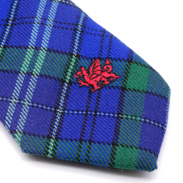 A Welsh Tartan Neck Tie - Medium Weight with a red dragon on it.