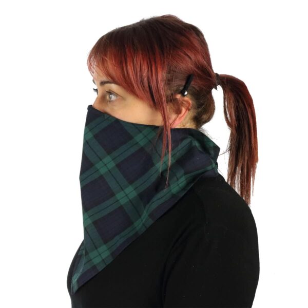 A woman wearing a green and black Tartan Bandana Masks - Wool Free made from Poly/Viscose.