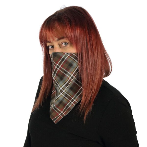 A woman with red hair wearing a plaid Tartan Bandana Masks - Wool Free.
