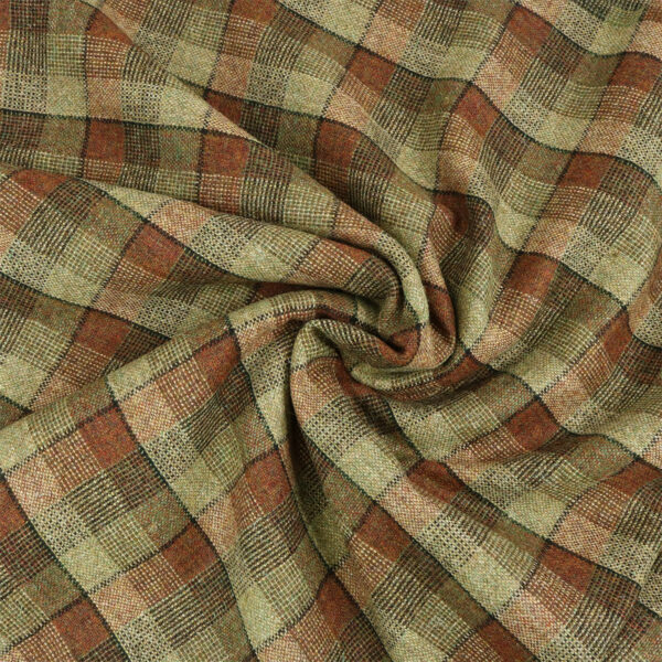 A close up of a brown and tan plaid fabric.