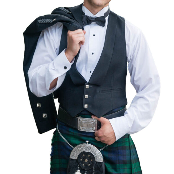 A man in a kilt poses for a photo in his own Build Your Own Kilt Rental.