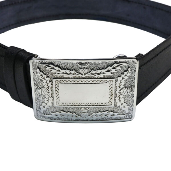 A Child's Belt and Buckle Set with an ornate buckle.