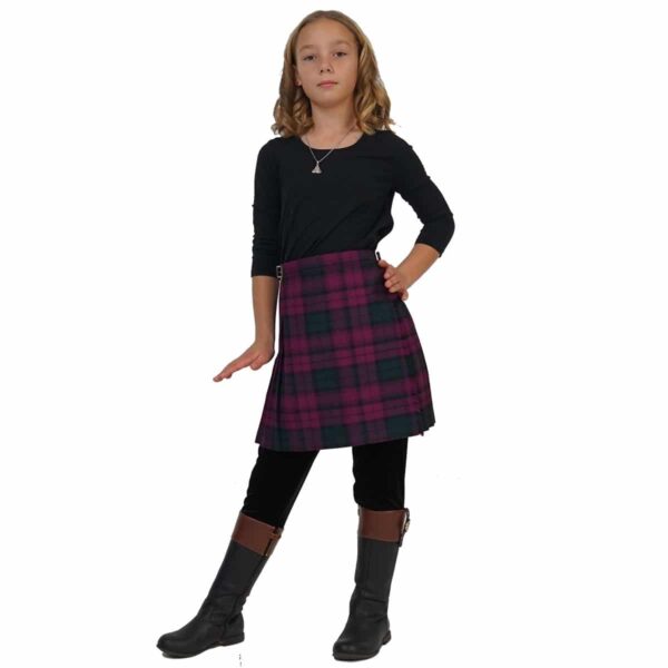 A young girl in a Premium Wool-Free Kid Kilt posing for a picture.