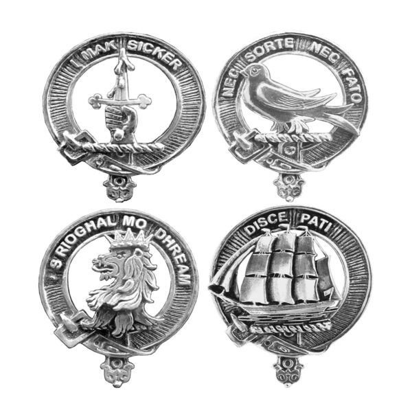 Four Clan Crest Pewter Cap Badges/Brooches on a white background.