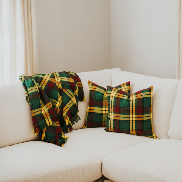 Homespun Tartan Blanket/Throw on a couch in a living room.