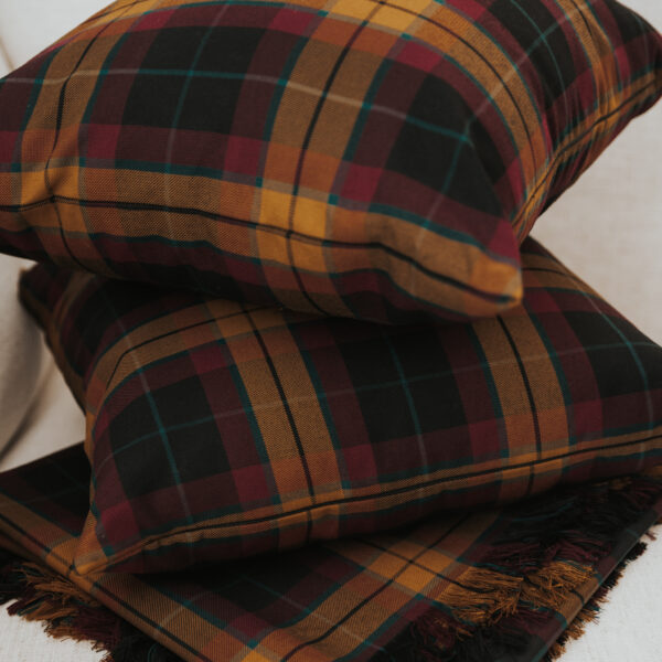 Two Homespun Tartan Blankets/Throws stacked on top of each other.