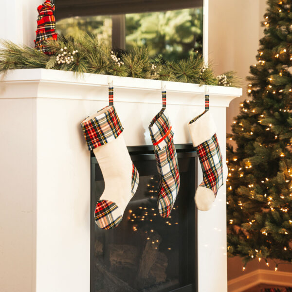 Christmas stockings hanging on a fireplace mantle.