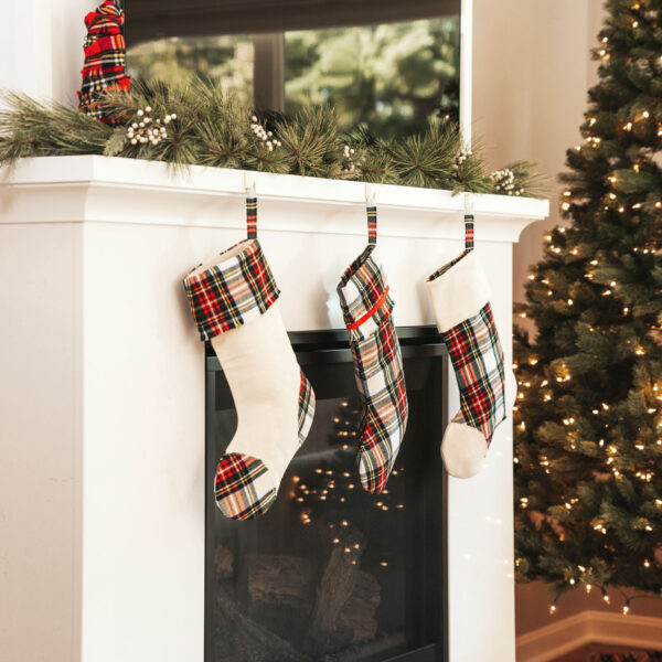Christmas stockings hanging on a fireplace mantel.