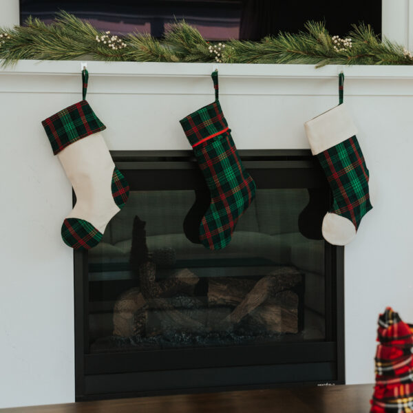 Tartan Stocking with Toes - Homespun Wool Blend hanging on a fireplace mantel.