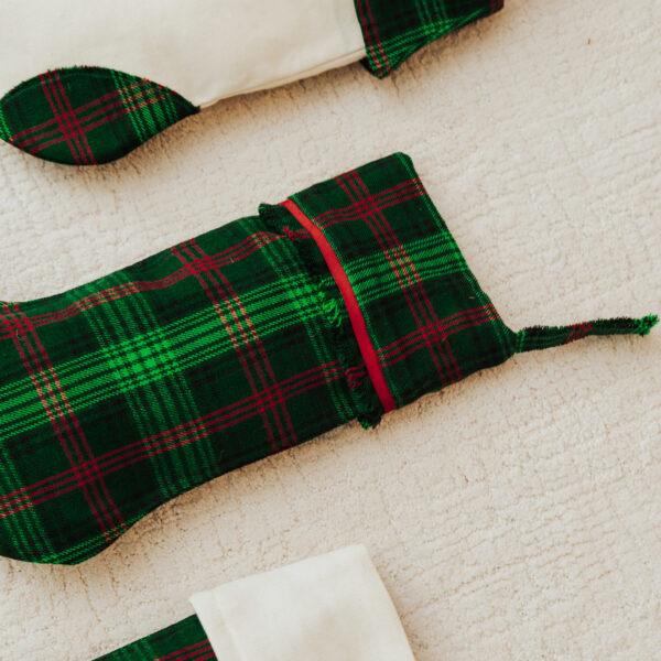 Three Tartan Stocking with Toes - Homespun Wool Blend christmas stockings on a white surface.