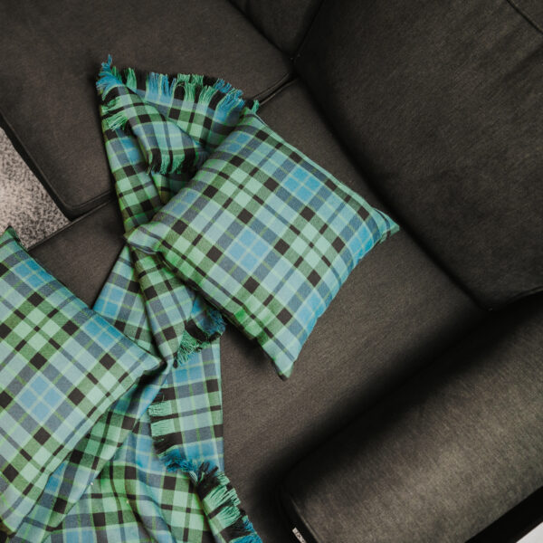Homespun Tartan Blanket/Throw on a couch.
