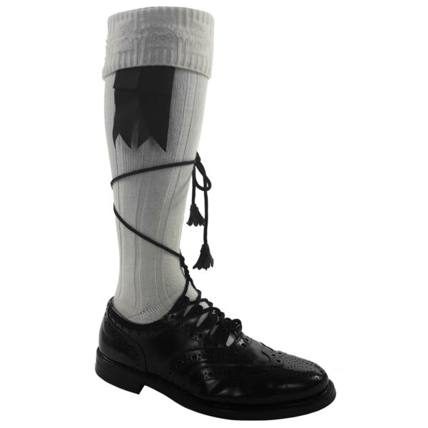 A pair of black and white socks with a tassel.