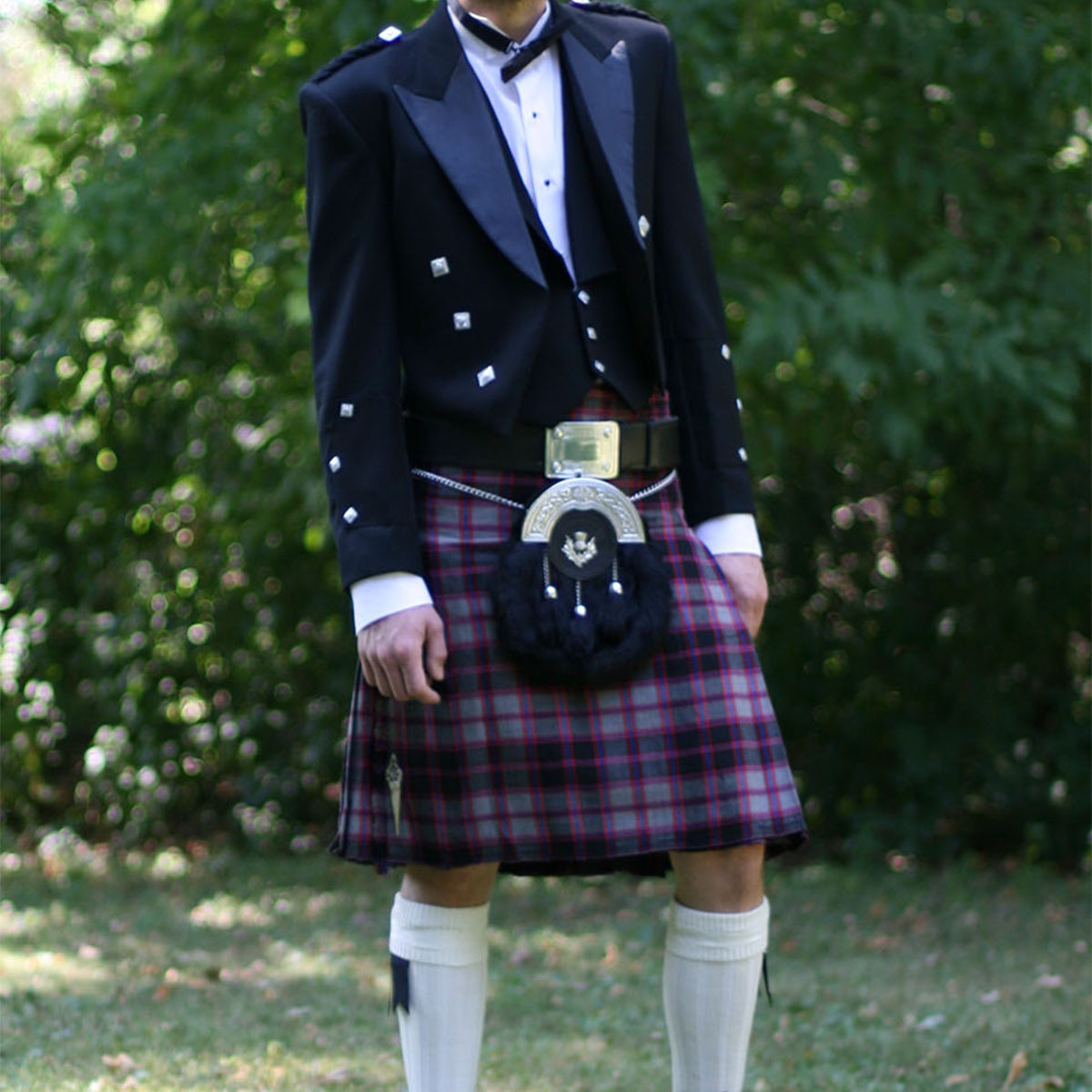 A man wearing a 9 Yard Medium Weight 13oz Premium Wool Formal Kilt.