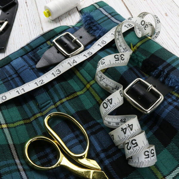 A Kilt Alteration — Move Straps and Buckles perfect for kilt alteration, complete with scissors and measuring tape.