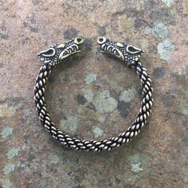 A Celtic Dragon Torc Bracelet with two Viking heads on it.