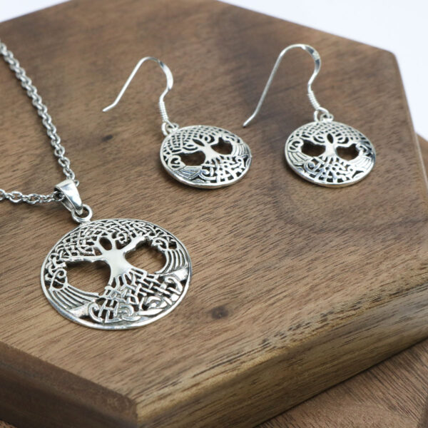 A silver tree of life necklace and Triquetra Sterling Silver Earrings.