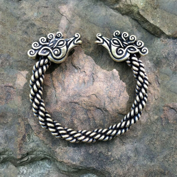 A Celtic Stag Torc Bracelet with a silver braided pattern.