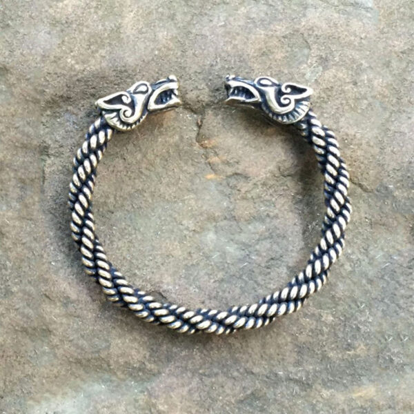 A Celtic Wolf Torc Bracelet, named "Celtic Wolf Torc Bracelet," enhanced with two intricate viking heads.