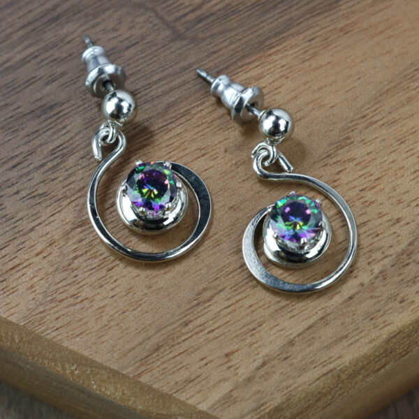 A pair of Mystic Crystal Spiral Earrings.