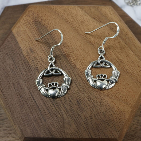 Triquetra Sterling Silver Earrings featuring a delicate Claddagh design.